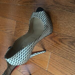 Christian Louboutin fishnet  pumps just like new. Non slip bottom